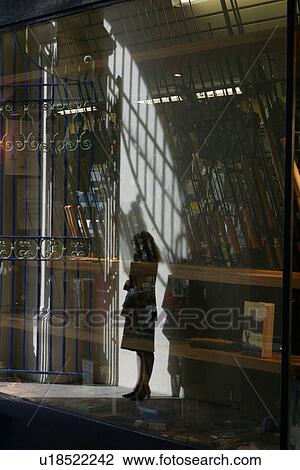 Reflection of woman talking on cel phone in shopping arcade, London, UK View Large Photo Image Stock Image - Reflection of woman talking on cel phone in shopping arcade, London, UK. Fotosearch