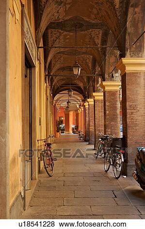 Stock Photo - Renaissance portico, fresoed vaulted ceiling with bicycles parked, Modena, . Fotosearch