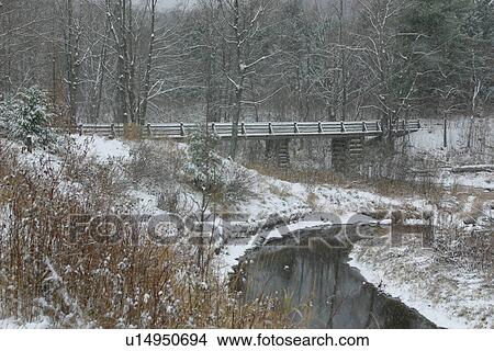 Snowy winter landscape, with bridge, river and trees covered with snow, Gatineau Park, Quebec, Canada View Large Photo Image Picture - Snowy winter landscape, with bridge, river and trees covered with snow, Gatineau Park, Quebec, Canada. Fotosearch