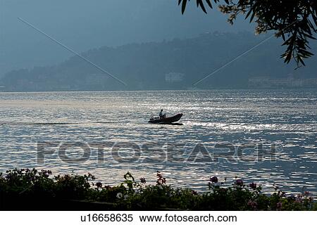 speed boat in motion on Lake Como, Italy, in evening light View Large Photo Image Stock Photography - speed boat in motion on Lake Como, Italy, in evening light. Fotosearch