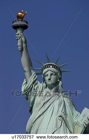Stock Photo - Statue of Liberty, front detail against deep blue sky. Fotosearch