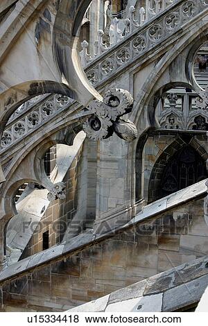 Stock Photo - Stone sculpture detail of flying buttress, Milan cathedral. Fotosearch