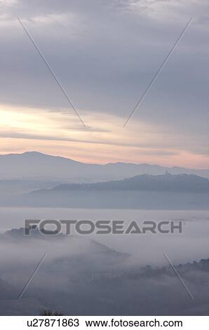 Sunrise over Tiber valley with grey pink and golden sky in the early morning mist of winter View Large Photo Image Stock Image - Sunrise over Tiber valley with grey pink and golden sky in the early morning mist of winter. Fotosearch
