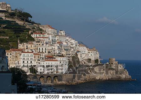 Town of Amalfi, showing coastal road and promontory fort, with blue sea and sky beyond View Large Photo Image Stock Photo - Town of Amalfi, showing coastal road and promontory fort, with blue sea and sky beyond. Fotosearch
