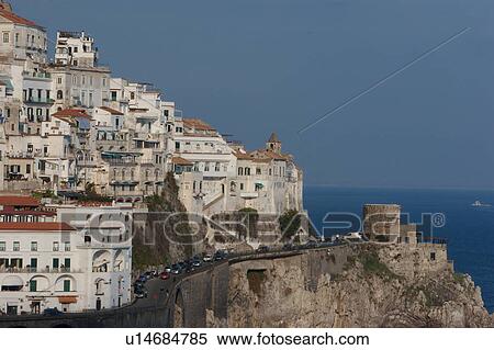 Town of Amalfi, showing coastal road and promontory fort, with blue sea and sky beyond View Large Photo Image Stock Photography - Town of Amalfi, showing coastal road and promontory fort, with blue sea and sky beyond. Fotosearch
