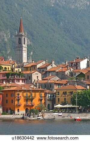 Varenna, view of harbour from water, sail boat moored, church bell tower and mountain slope in background View Large Photo Image Stock Image - Varenna, view of harbour from water, sail boat moored, church bell tower and mountain slope in background. Fotosearch