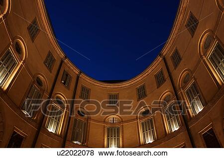 View looking up, Ferrara Theatre inner courtyard, with night sky above, illuminated circular building View Large Photo Image Stock Photo - View looking up, Ferrara Theatre inner courtyard, with night sky above, illuminated circular building. Fotosearch