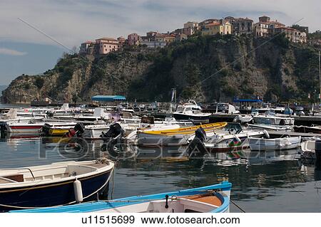 View of Agropoli harbour with small fishing boats moored in rows, and town of Agropoli on hill top beyond, on sunny, summer morning View Large Photo Image Stock Photo - View of Agropoli harbour with small fishing boats moored in rows, and town of Agropoli on hill top beyond, on sunny, summer morning. Fotosearch