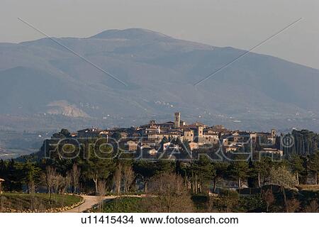 View of hilltop medieval town in early morning spring light, with bell tower visible View Large Photo Image Picture - View of hilltop medieval town in early morning spring light, with bell tower visible. Fotosearch