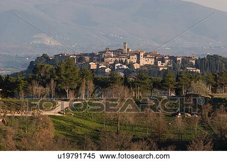 View of hilltop medieval town in early morning spring light, with bell tower visible View Large Photo Image Stock Photography - View of hilltop medieval town in early morning spring light, with bell tower visible. Fotosearch