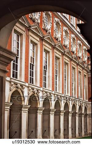 View of part of Hampton Court courtyard from under entrance archway View Large Photo Image Stock Image - View of part of Hampton Court courtyard from under entrance archway. Fotosearch