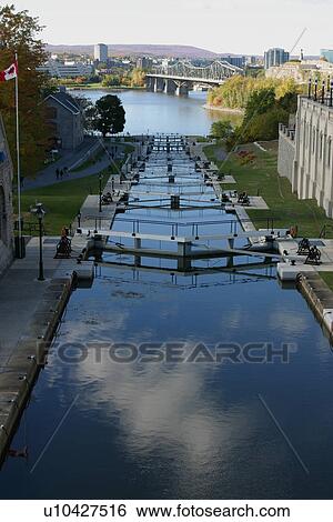 Stock Photograph - View of Rideau Canal and locks, Ottawa river with Confederation Bridge to Quebec, Gatineau hills in background. Fotosearch