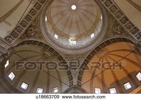 Stock Photo - View upwards of central cupola, and 2 of 4 surrounding cupolas, with arch and column surround, Todi Tempio di Bramante, Umbria, Italy. Fotosearch