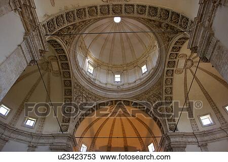 Stock Image - View upwards of central cupola, and 3 of 4 surrounding cupolas, with arch and column surround, Todi Tempio di Bramante, Umbria, Italy. Fotosearch