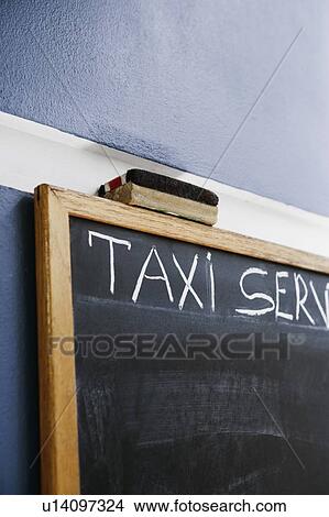 Close-up of a blackboard and a duster View Large Photo Image Picture - Close-up of a blackboard and a duster. Fotosearch
