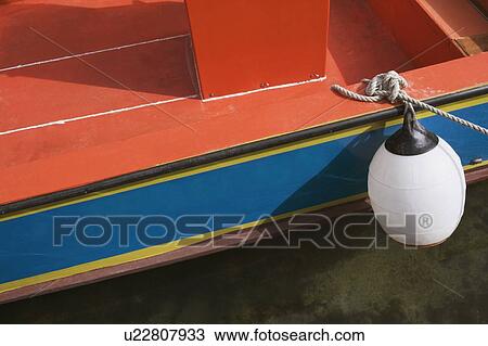 Close-up of a buoy hanging from a boat View Large Photo Image Stock Image - Close-up of a buoy hanging from a boat. Fotosearch