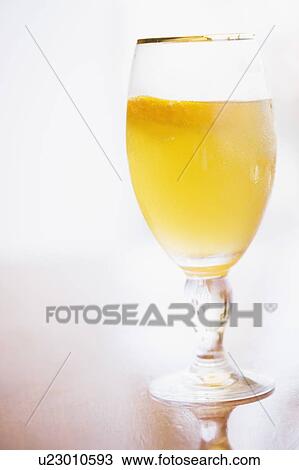 Stock Image - Close-up of a glass of orange juice. Fotosearch