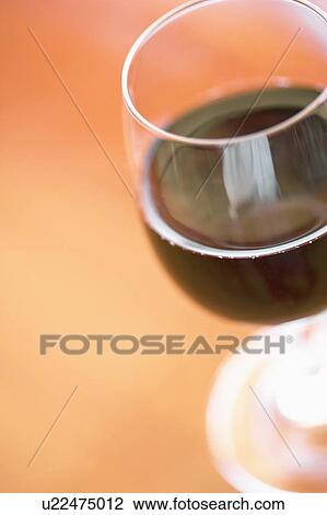 Stock Image - Close-up of a glass of red wine. Fotosearch