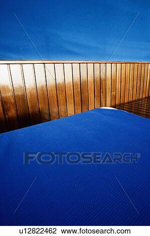 Close-up of a lounge chair on a deck View Large Photo Image Stock Image - Close-up of a lounge chair on a deck. Fotosearch