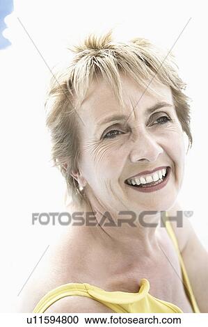 Close-up of a mature woman smiling View Large Photo Image Stock Image - Close-up of a mature woman smiling. Fotosearch