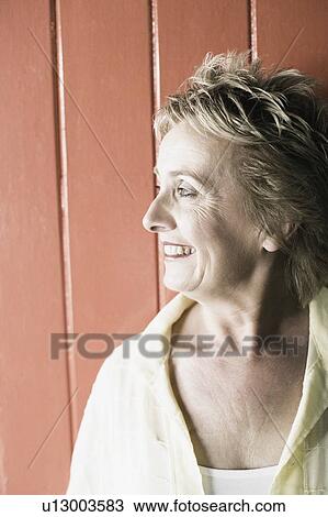 Close-up of a mature woman smiling View Large Photo Image Stock Image - Close-up of a mature woman smiling. Fotosearch