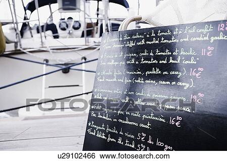 Stock Photograph - Close-up of a menu list on a blackboard. Fotosearch