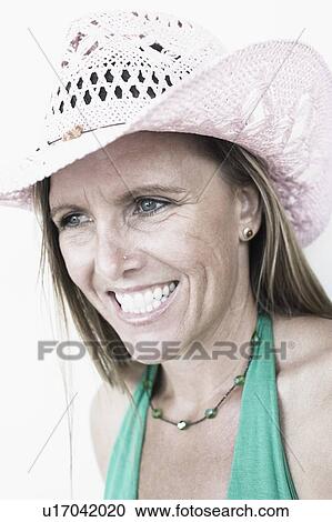 Close-up of a mid adult woman smiling View Large Photo Image Stock Image - Close-up of a mid adult woman smiling. Fotosearch