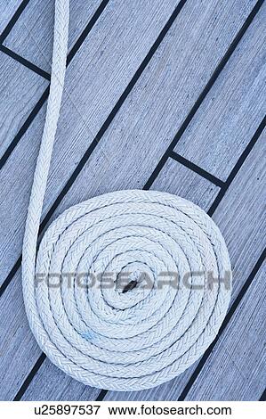Close-up of a rope on the deck of a sailboat View Large Photo Image Stock Photo - Close-up of a rope on the deck of a sailboat. Fotosearch