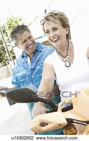 Stock Image - Close-up of a senior man and a mature woman smiling. Fotosearch