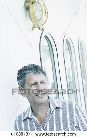 Close-up of a senior man smiling View Large Photo Image Stock Image - Close-up of a senior man smiling. Fotosearch