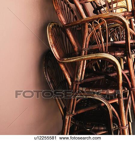 Stock Image - Close-up of a stack of bamboo chairs in a store. Fotosearch