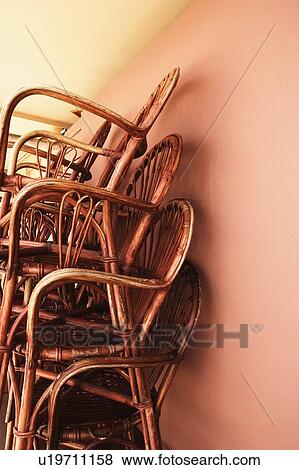 Stock Photo - Close-up of a stack of bamboo chairs in a store. Fotosearch