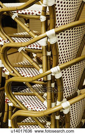 Stock Photograph - Close-up of a stack of bamboo chairs in a store. Fotosearch