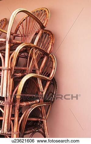 Stock Photograph - Close-up of a stack of bamboo chairs in a store. Fotosearch