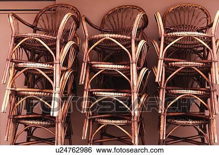 Close-up of a stack of bamboo chairs in a store View Large Photo Image Stock Photograph - Close-up of a stack of bamboo chairs in a store. Fotosearch