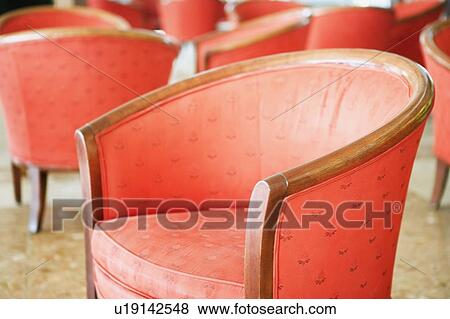 Close-up of an armchair in a lobby View Large Photo Image Stock Photo - Close-up of an armchair in a lobby. Fotosearch
