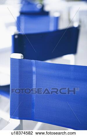 Stock Image - Close-up of an empty chair in a cafe. Fotosearch