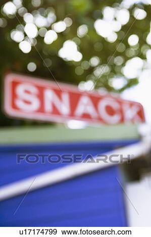 Stock Photo - Close-up of an information sign on the top of a restaurant. Fotosearch