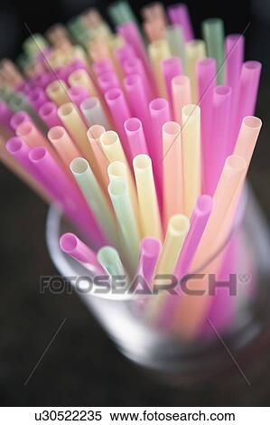 Stock Photography - Close-up of drinking straws in a glass. Fotosearch