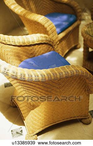 Close-up of empty wicker chairs View Large Photo Image Stock Photo - Close-up of empty wicker chairs. Fotosearch
