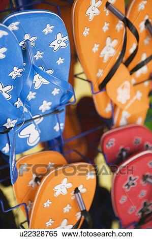 Stock Photography - Close-up of slippers at a market stall. Fotosearch