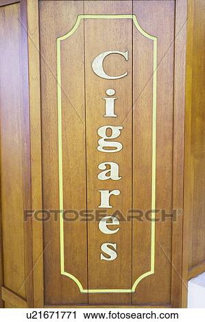 Stock Image - Close-up of text Cigares on a wooden board. Fotosearch