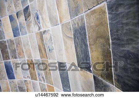 Close-up of tiles on a wall View Large Photo Image Stock Image - Close-up of tiles on a wall. Fotosearch