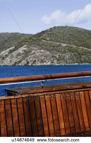 Stock Photo - Close-up of wooden railing of a boat. Fotosearch