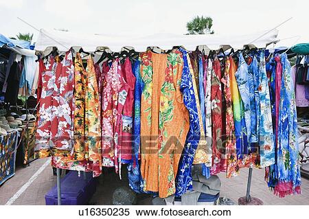 Stock Photography - Clothes hanging in a market stall. Fotosearch