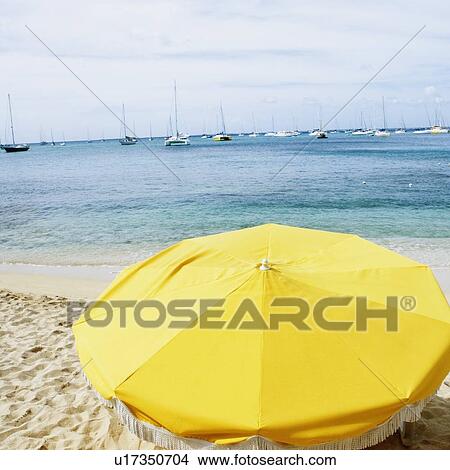 High angle view of a beach umbrella on the beach View Large Photo Image Picture - High angle view of a beach umbrella on the beach. Fotosearch