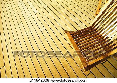 Stock Photo - High angle view of a deck chair on a deck. Fotosearch
