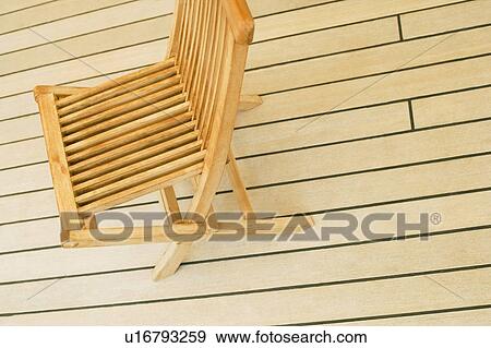 Stock Photo - High angle view of a deck chair on a deck. Fotosearch