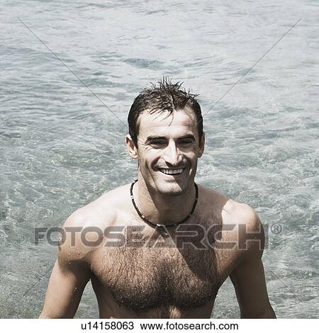 High angle view of a mid adult man standing in a river and smiling View Large Photo Image Stock Image - High angle view of a mid adult man standing in a river and smiling. Fotosearch