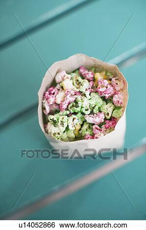 Stock Photograph - High angle view of popcorn in a paper bag. Fotosearch